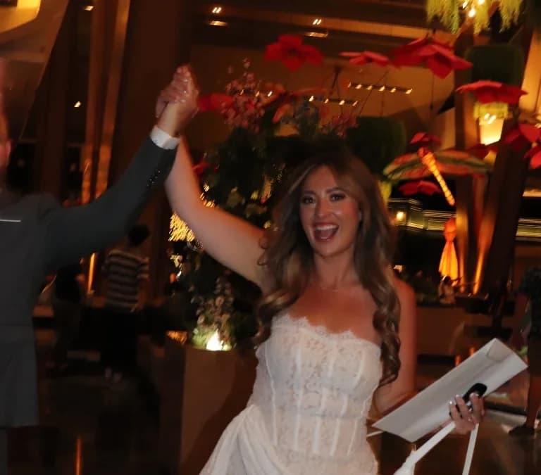 Newlyweds celebrating in luxurious wedding venue setting