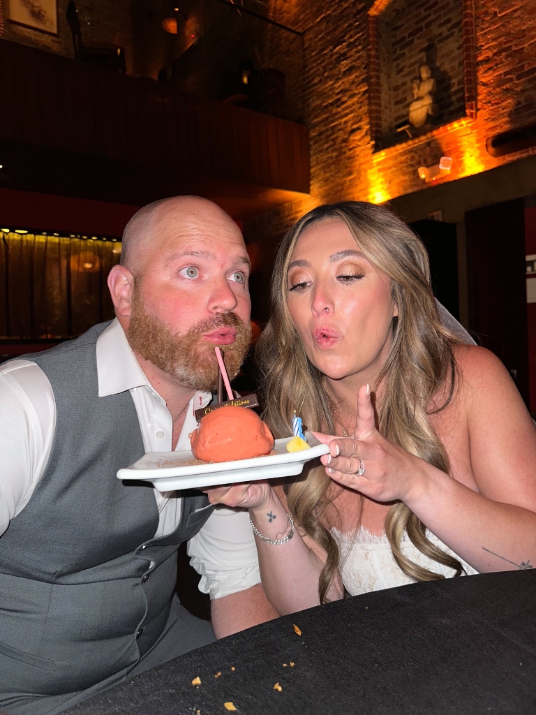 Couple cake cutting with sparkler candle